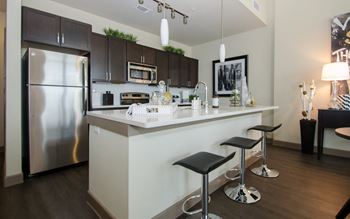 Kitchen with large island and chairs